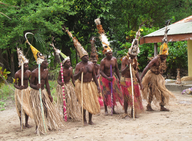 Villagers on Uluveo, in the Maskelyne Islands, prepare for a traditional dance