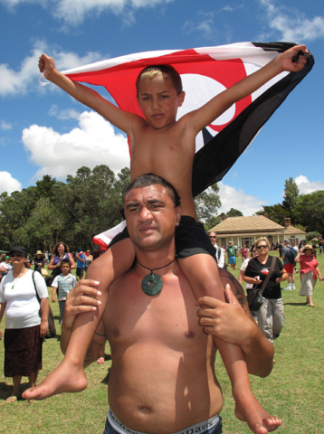 Ciaron Taua, 6, and Eric Peito take part in the Waitangi Day hīkoi (march)