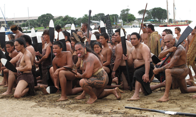Kaihoe (paddlers) perform a haka on Tii Beach