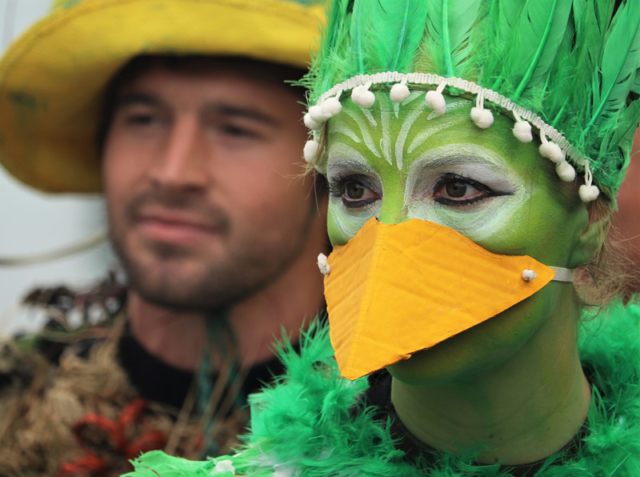 JULY: Jess Magon, aka Total Green Bird, awaits her turn to fly from the wharf in Russell’s Birdman Festival. Photo: Peter de Graaf