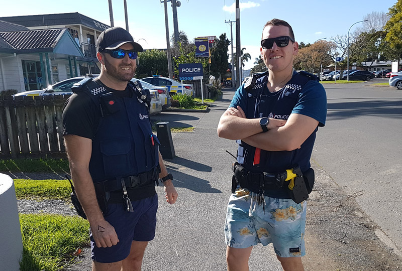 JUNE: Sergeant Rob Eke and Constable Tal Easton still in togs after nabbing a wanted man during a mid-winter swim. Photo: Peter de Graaf