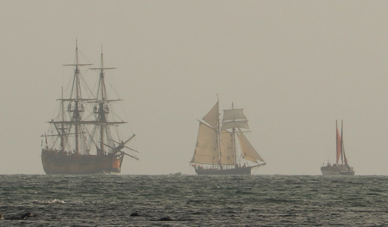 NOVEMBER: Tall ships and a Tahitian voyaging waka appear on the horizon at dawn as Tuia 250 gets underway in the Bay of Islands. Photo: Peter de Graaf