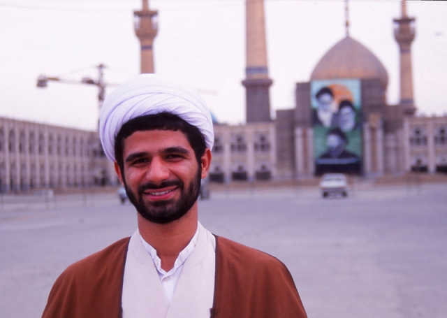 Friendly mullah Ali with Ayatollah Khomeini’s mausoleum under construction behind him
