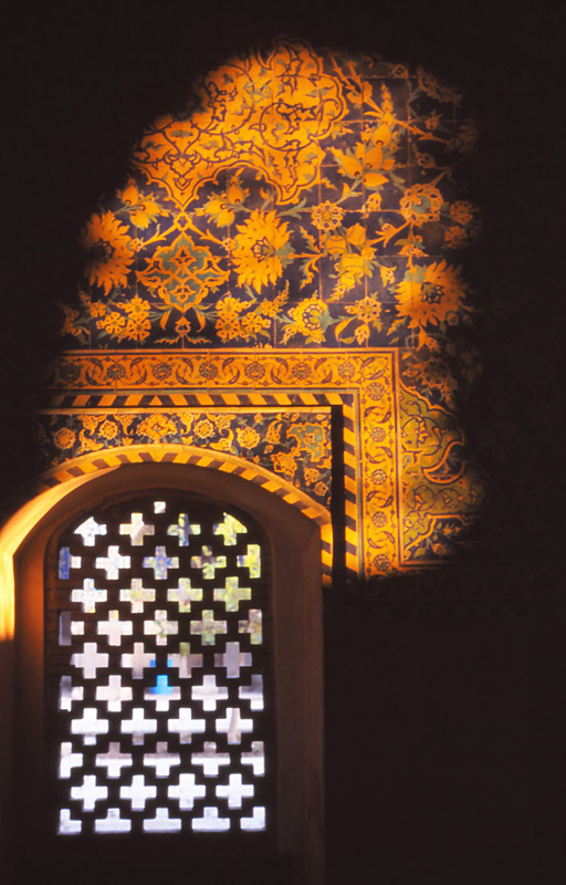 A patch of sunlight illuminates tilework inside the Imam Mosque, Esfahan