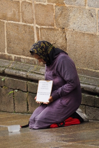 A beggar in Santiago de Compostella is a reminder of Spain’s economic woes