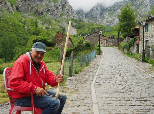 A man works on a walking stick in Caín, a village in Garganta del Cares (Cares Gorge)
