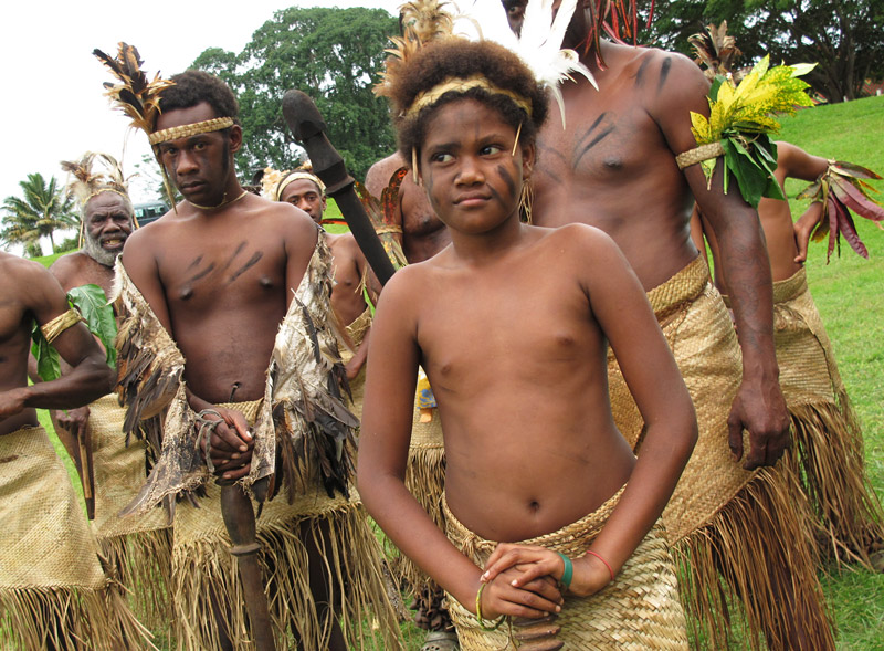 A young performer awaits his turn to go on stage during blackbirding commemorations in Port Vila