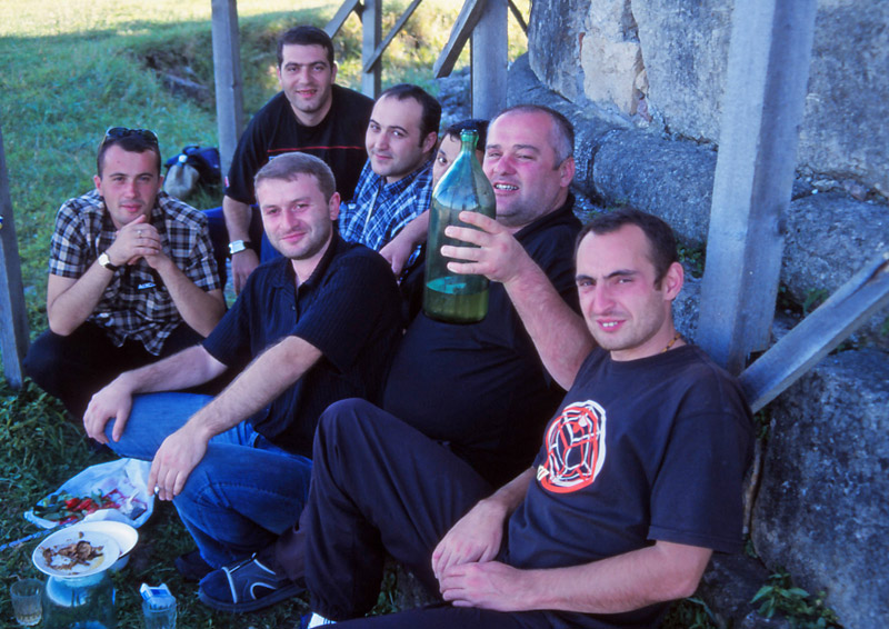 Georgian men celebrate a birthday with home-made wine in Kuitaisi