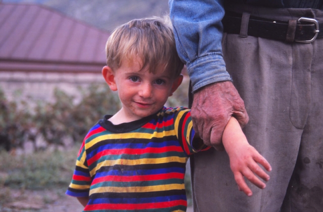 A boy and his grandfather in the village of Tmogvi