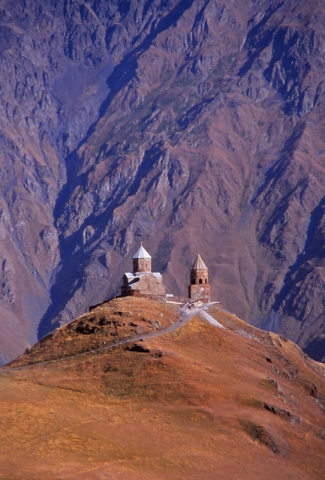 The 14th century Tsminda Sameba Church perches on a 2170m-high peak in the Caucasus Mountains