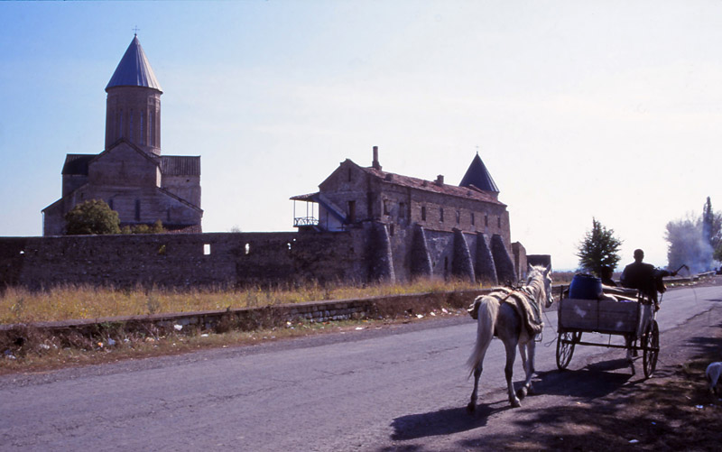 A horse-drawn cart passes the 11th century Alaverdi Monastery