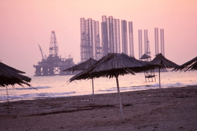 Oil rigs loom off Baku’s premier swimming spot, Şixov Beach