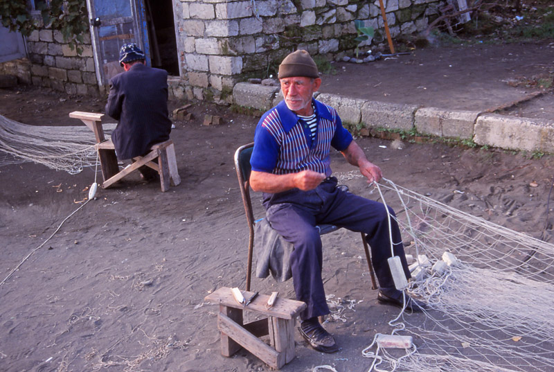 Caspian Sea fishermen tend their nets at Lenkeran