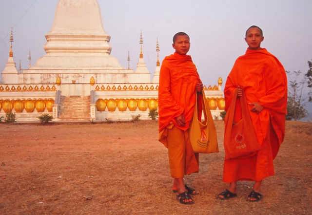 Monks at Phu That stupa in Udomxai, northern Laos.