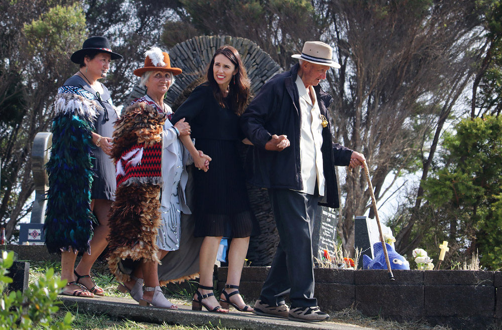 February: Prime Minister Jacinda Ardern is escorted to the grave of land rights leader Dame Whina Cooper by her daughter Hine Puru and son Joe Cooper during a visit to Panguru. Photo: Peter de Graaf