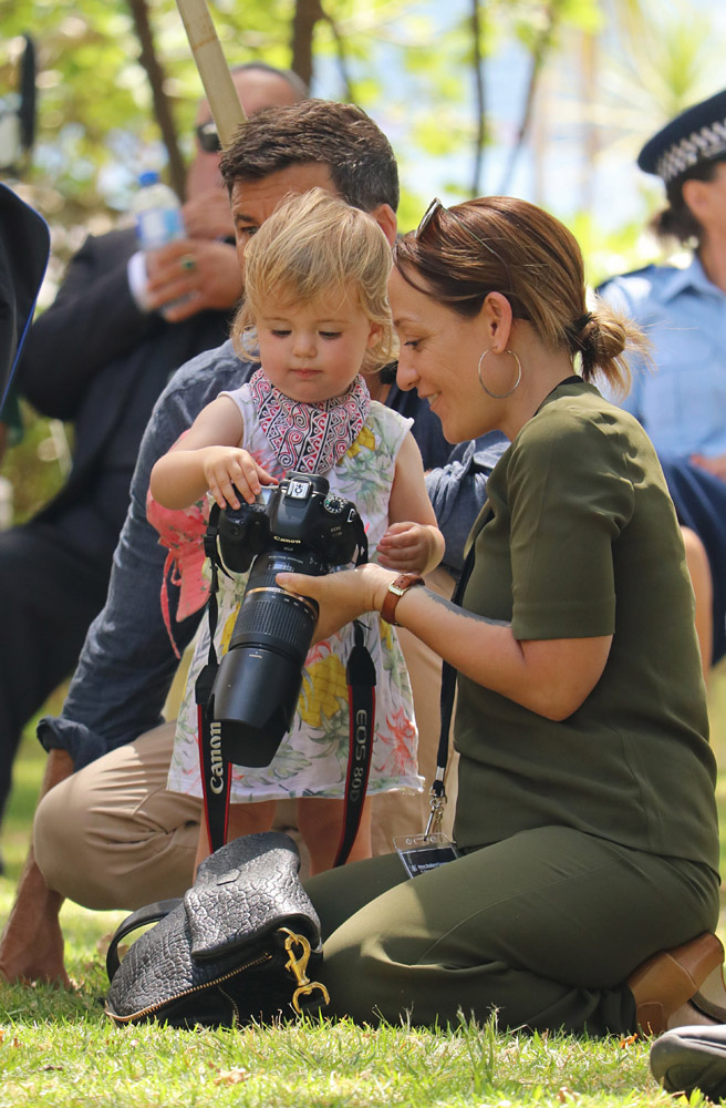 February: Budding photojournalist Neve Ardern Gayford, daughter of Prime Minister Jacinda Ardern, checks out a camera at Waitangi. Photo: Peter de Graaf