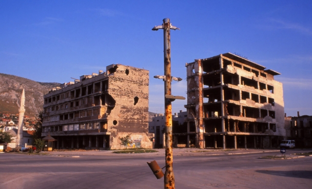 Bosnia, 1999: War-damaged traffic lights and apartment buildings in central Mostar