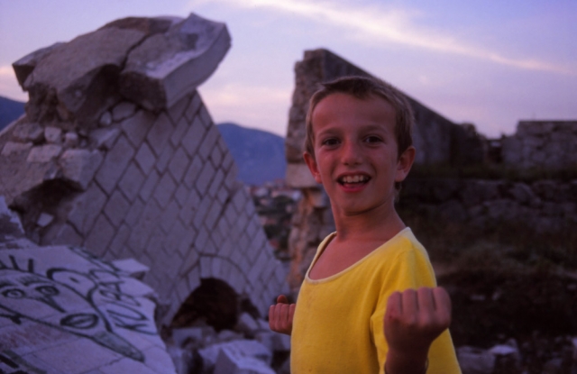 Bosnia, 1999: A Bosnian boy plays in the ruins of Mostar