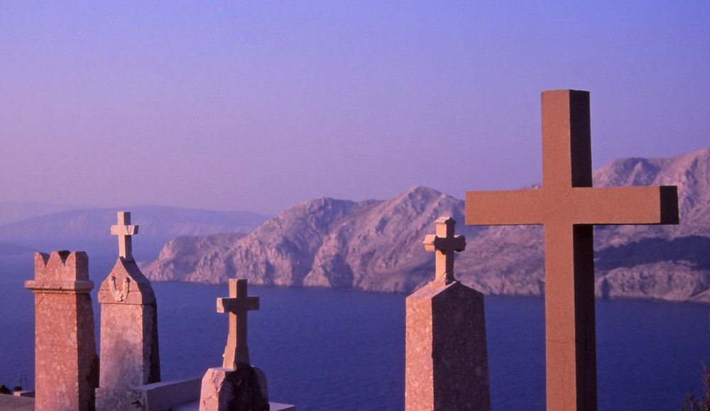 Croatia, 1999: Baška cemetery, on the island of Krk, overlooks the Adriatic Sea and the rugged Dalmatian coast