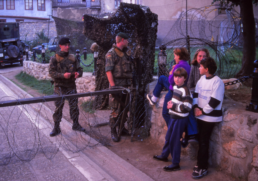 Kosovo, 1999: Girls talk to German peacekeepers in Prizren