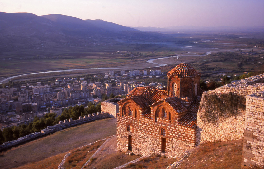 The 14th century Church of the Holy Trinity overlooks modern suburbs and the meandering River Osum in Berat