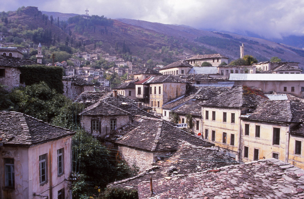 Gjirokastra is known for its historic slate-roofed houses and dramatic setting on a mountain spur