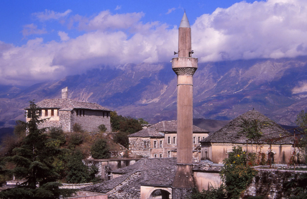 A minaret and stone houses in historic Gjirokastra, southern Albania