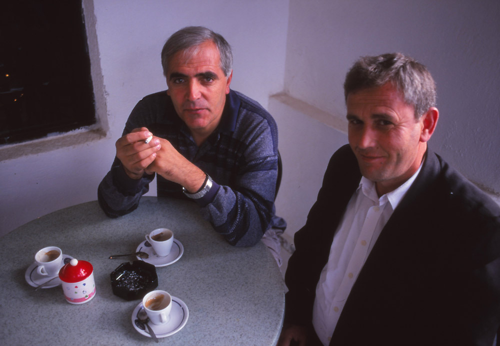 Writer Petrit Palushi, left, and friend at a cafe in Kukës