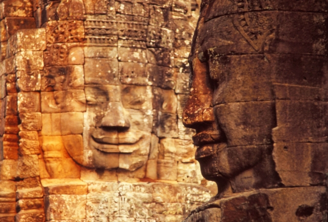 Two of the 216 giant faces which decorate the 54 towers of the Bayon, a 12th century temple at the centre of Angkor Thom ("Great City")