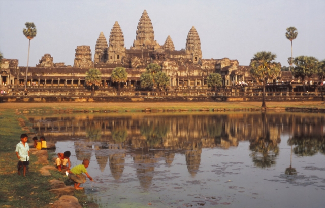 Children play in a ceremonial pool at Angkor Wat, still the world's biggest religious structure
