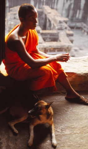 A young monk and his companion at the highest level of Angkor Wat