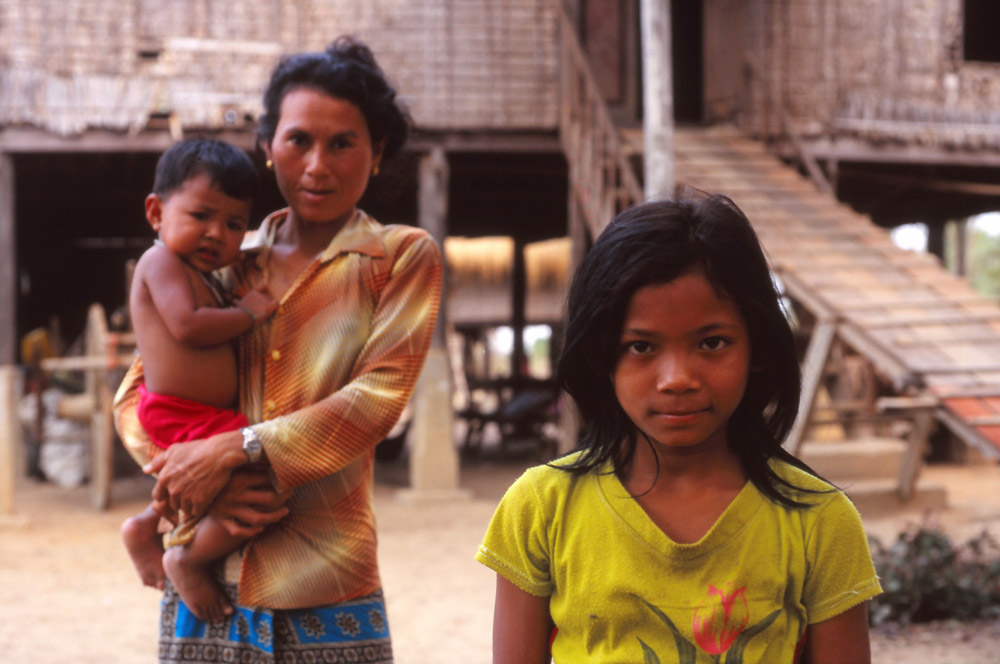 A family outside their home near Battambang in rural Cambodia