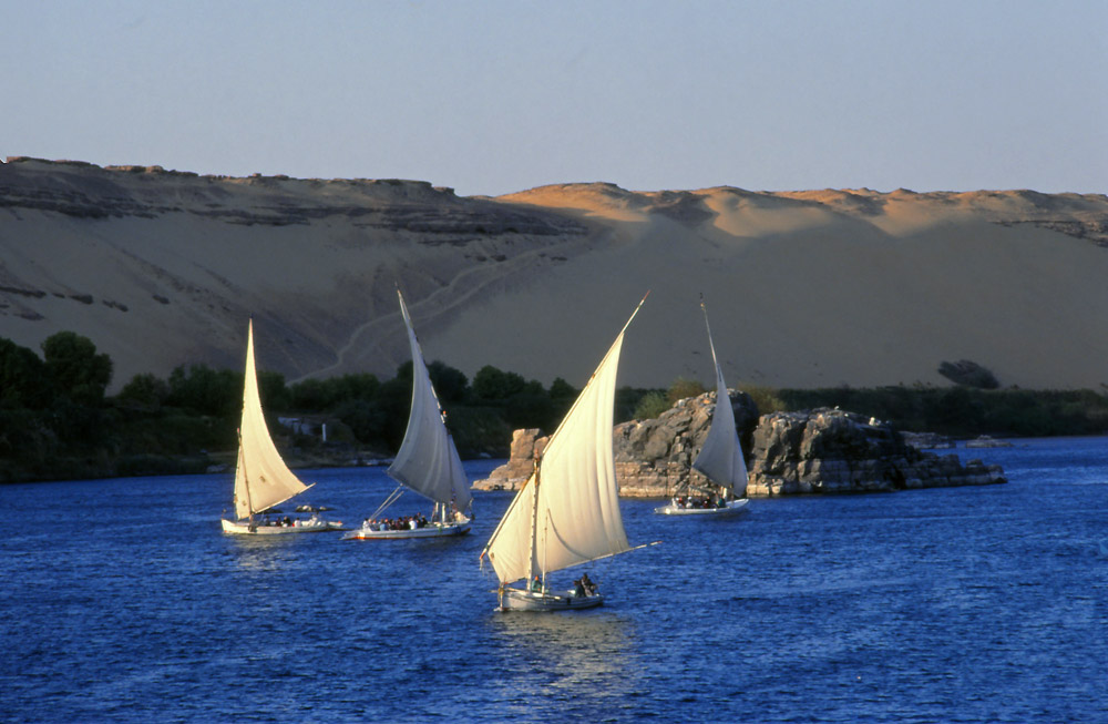 Traditional wooden sailing boats known as felucca ply the Nile at Aswan