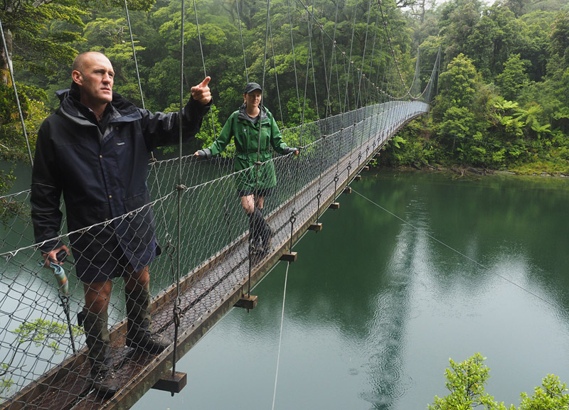 Bard delivers a soliloquy from a swingbridge over Pyke River