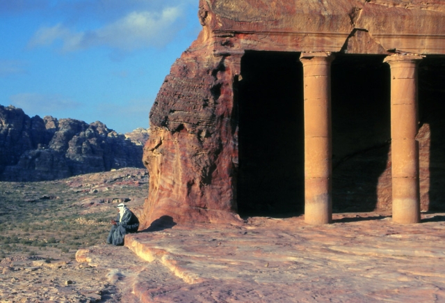 A Bedouin man contemplates the desert scenery surrounding the Urn Tomb