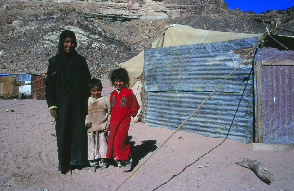 A Bedouin family next to their home in Wadi Rum